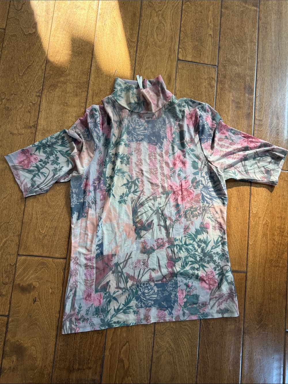 Anthropologie Mesh print top with flower pattern